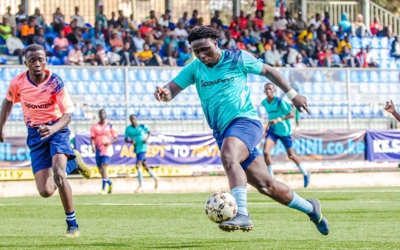 Supporting local football teams in Kasarani, Kenya